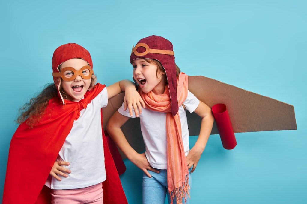 kids playing pretend airplane