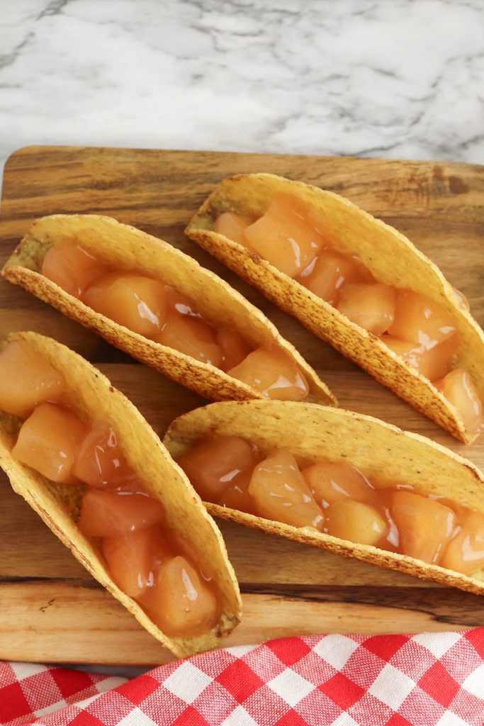 add apple filling to taco shells