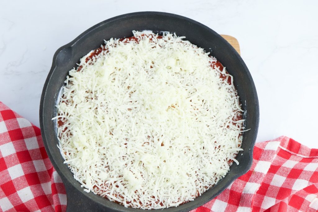 add cheese to the top of the baked pizza dip